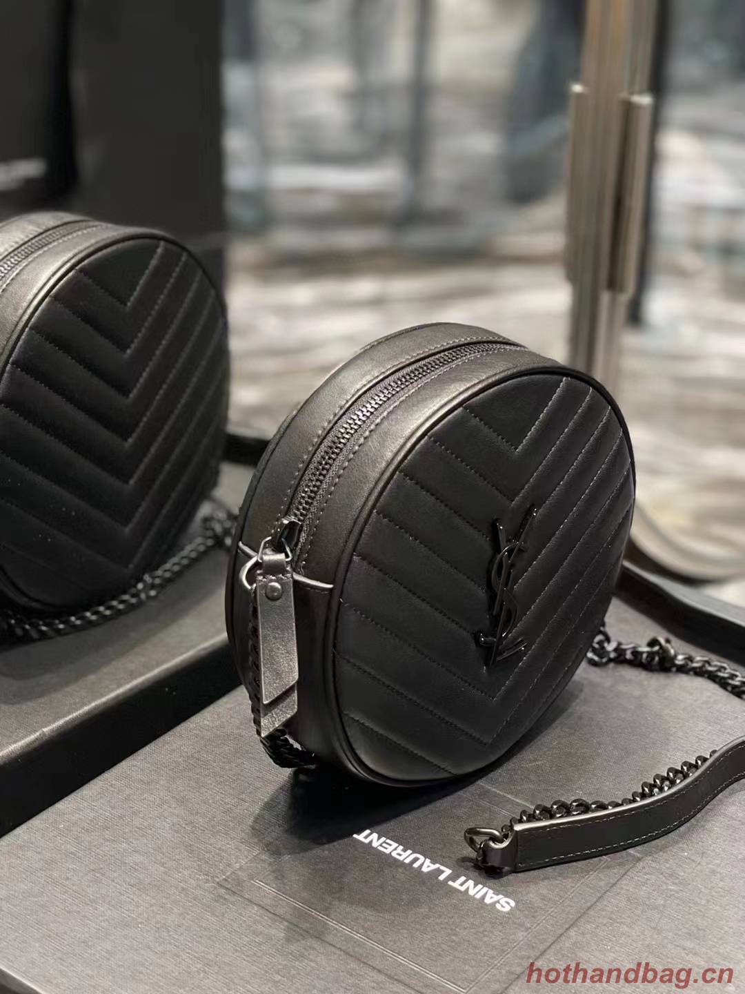 SAINT LAURENT VINYLE ROUND CAMERA BAG IN CHEVRON-QUILTED GRAIN DE POUDRE EMBOSSED LEATHER 6104361 black